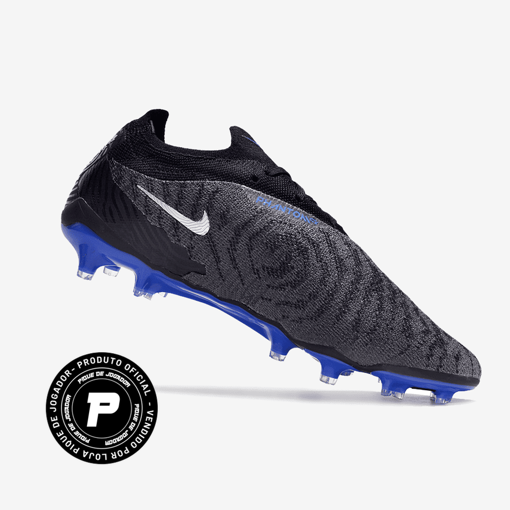 Chuteira Nike Phantom GX Elite Campo, , Arquibancada Esportes, A Chuteira Nike Phantom GX Elite Campo foi desenvolvida para jogadores que buscam o máximo em desempenho dentro dos gramados. Um modelo elite, com materiais profissionais e tecnologias que elevam seu jogo. Com estrutura leve, encaixe preciso e solado projetado para tração em alta velocidade, essa chuteira garante estabilidade e explosão nos momentos decisivos. Jogue como os melhores. Sinta a diferença nos pés. Ficha Técnica Nome: Chuteira Nike P